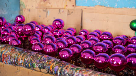 Christmas balls in the workshop for the production of Christmas toys, painting balls in the shop.