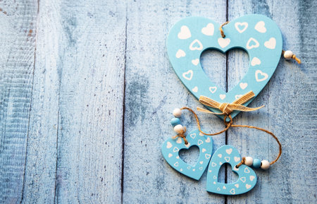 Love hearts on wooden texture background. Valentines day card concept. Heart for Valentines Day Background.の写真素材