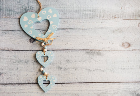 Love hearts on wooden texture background. Valentines day card concept. Heart for Valentines Day Background.の写真素材