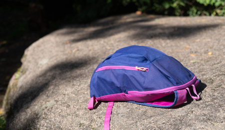 Tourist backpack on background of mountains in Swiss Alps. Travel outdoor concept