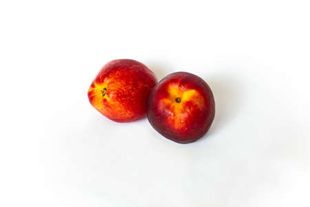 Fresh nectarines on a white backgroundの写真素材
