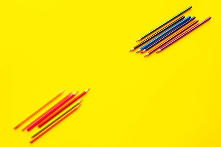 Color bright pencils on a yellow background.の写真素材