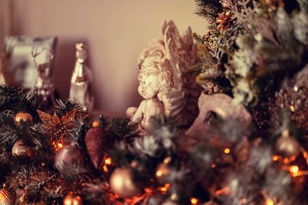 Christmas decorations on the tree in blur. A festive mood at home.の写真素材