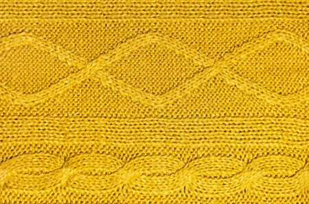 Large woolen background knitted from blue thread. View from above. Element of clothes, style drawing.の写真素材