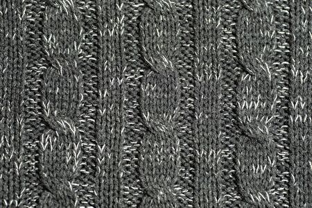 Large woolen background knitted from blue thread. View from above. Element of clothes, style drawing.の写真素材