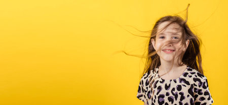Funny portrait of a teenage girl with flowing hair, banner, copy spaceの写真素材