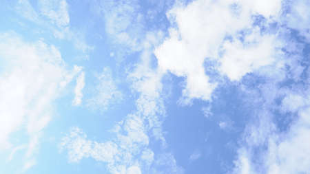 Clear blue sky, with little clouds, on a clear sunny day.の写真素材