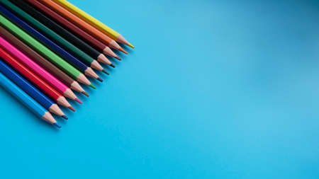 Colored pencils on a blue background. Great For Your Back To School. Art Supplies Related Projects.の写真素材