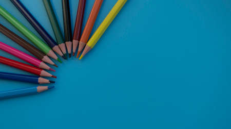 Colored pencils on a blue background. Great For Your Back To School. Art Supplies Related Projects.の写真素材