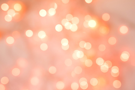 Living Coral background of blurred lights for holidays and partiesの写真素材