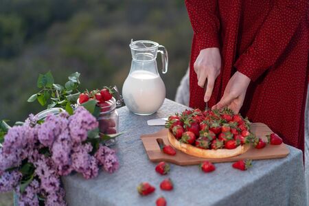 Table on the nature with a view of the mountains in the setting sun.の写真素材