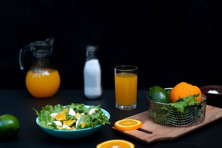 Delicious orange salad, lettuce and mozzarella cheese. Orange juice and salt.の写真素材