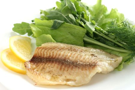 tilapia with lettuce and rucolaの写真素材