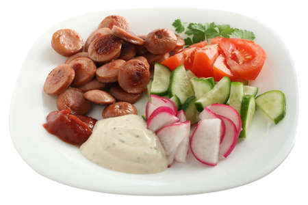 cut sausage with vegetables and saucesの写真素材