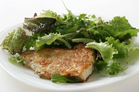 fried flounder with saladの写真素材