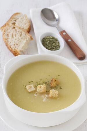 chicken soup in the white bowlの写真素材