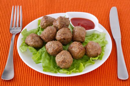 meatballs  on the plate with sauceの写真素材