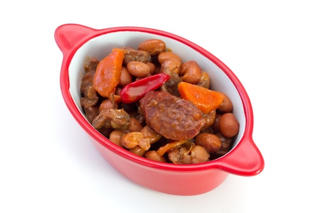 meat with sausages and beans in the bowl on white backgroundの写真素材