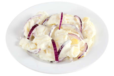 potato salad with mayonnaise on the plate on white backgroundの写真素材