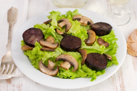 salad with mushrooms and sausagesの写真素材