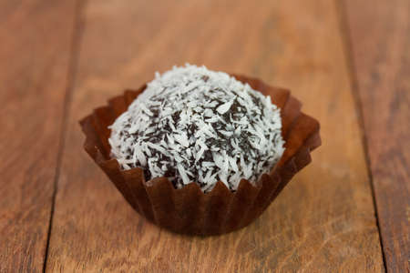 chocolate truffles with coconut on the tableの写真素材
