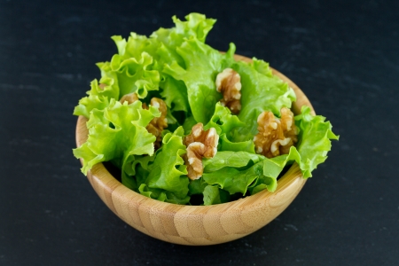 salad with walnut in bowlの写真素材