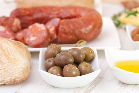 olives with chourico, bread and olive oilの写真素材