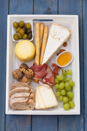 cheese platter on blue backgroundの写真素材