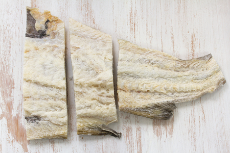 salted cod fish on white backgroundの写真素材