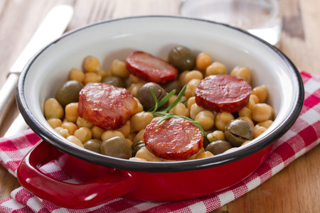 chick pea with smoked sausages on dishの写真素材
