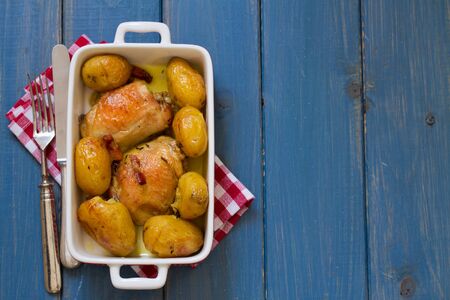 chicken with potato in dishの写真素材