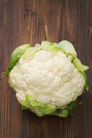 cauliflower on brown wooden backgroundの写真素材