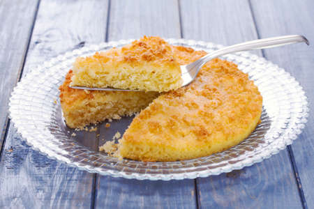 coconut tarte on dish on blue background