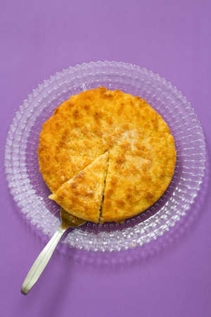 coconut tarte on white plate in blue backgroundの写真素材