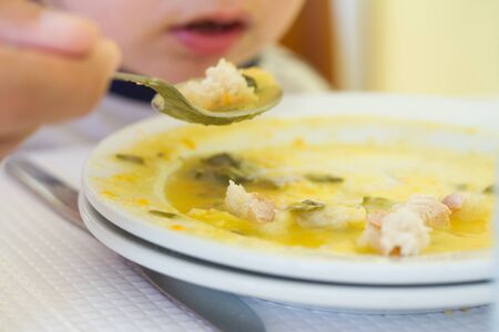 baby eating vegetablesの写真素材