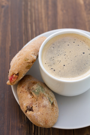 cup of coffee with cookies on wooden backgroundの写真素材