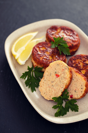 fish balls with lemon on dishの写真素材