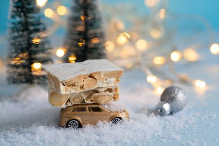 turron on small toy car Christmas backgroundの写真素材