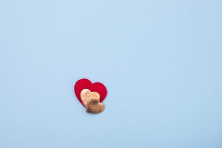 red and golden heart on paper background