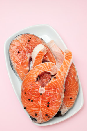 fresh raw salmon with black pepper on dishの写真素材