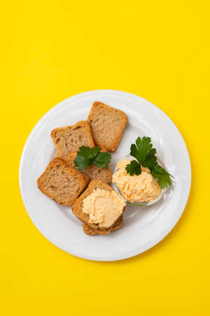 toasts with fish pate on white plateの写真素材