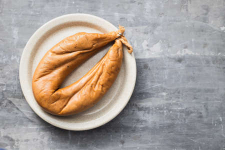 typical portuguese smoked sausage Farinheira on the dish on ceramic backgroundの写真素材