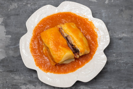 typical Portuguese food Francesinha in white dishの写真素材