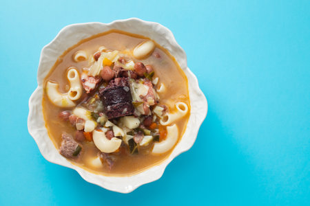 typical portuguese soup Sopa a lavrador in beautiful dish on blue backgroundの写真素材