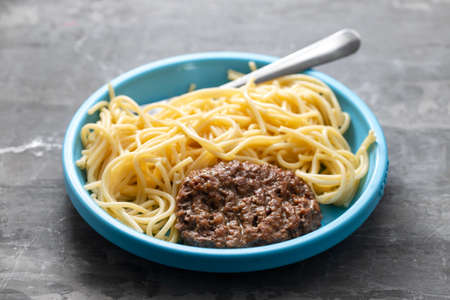 spaghetti with hamburger in blue small plateの写真素材