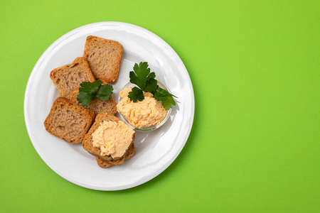 toasts with fish pate on white plateの写真素材