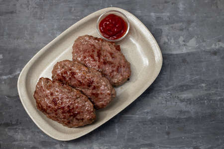 fried ground meat with tomato sauce on dishの写真素材