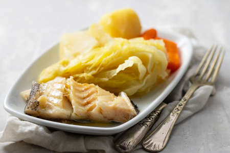 boiled cod fish with boiled vegetables and eggの写真素材