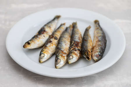 fried sardines on white small dishの写真素材