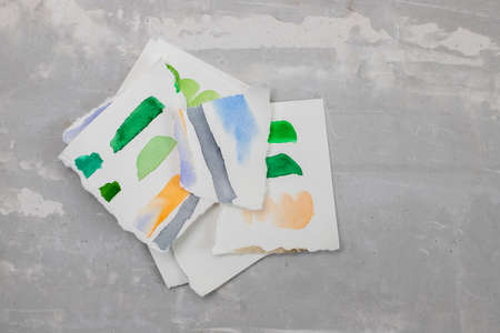 torn paper with a design on gray ceramicsの写真素材
